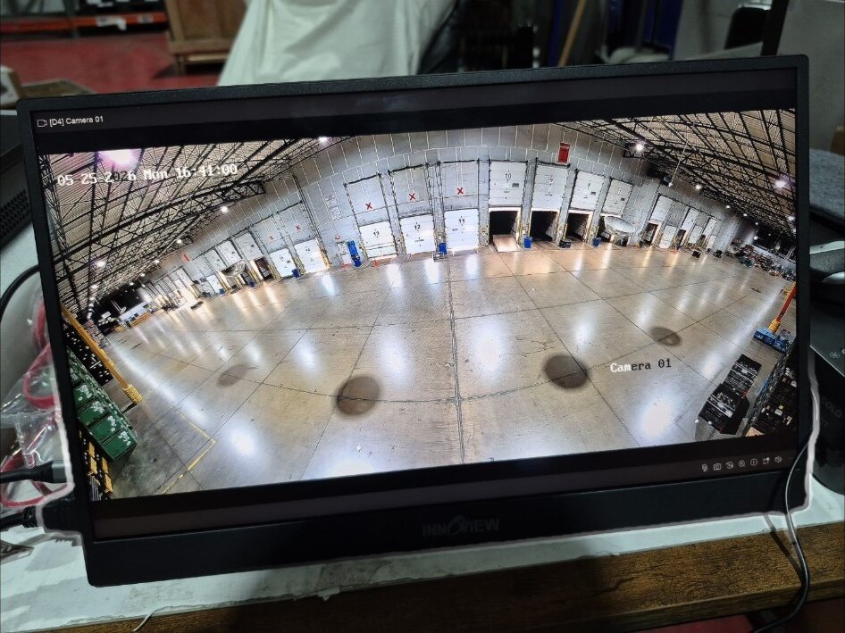 Wide security camera view of a commercial warehouse